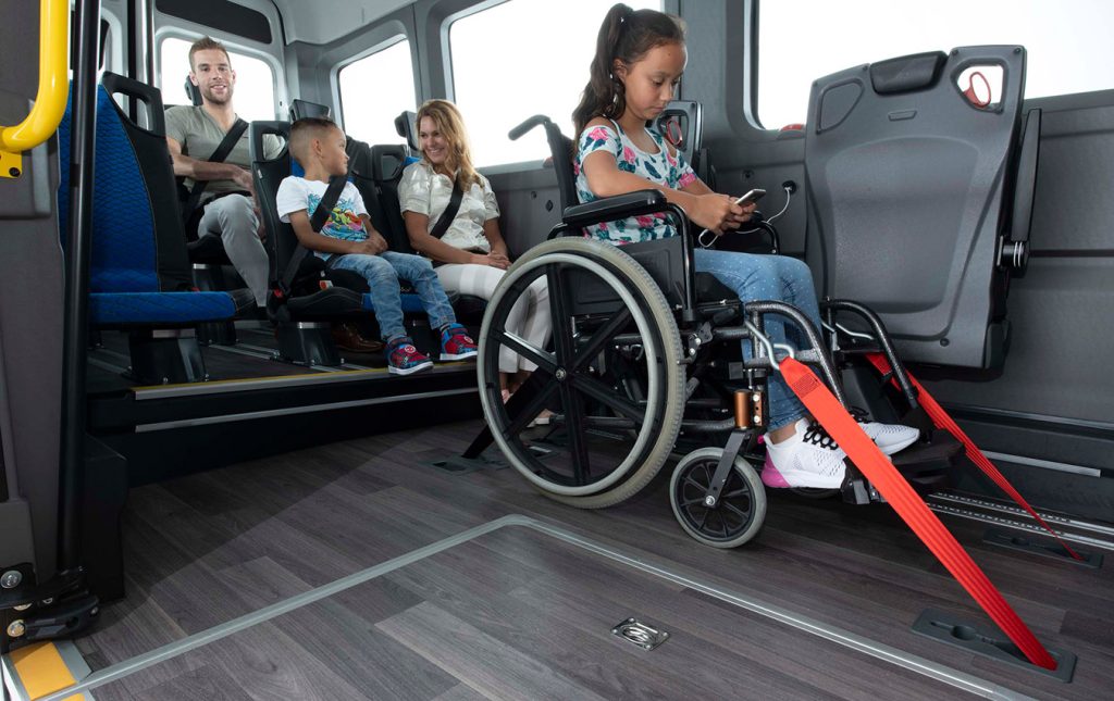 safer riding conditions for wheelchairs in road vehicles