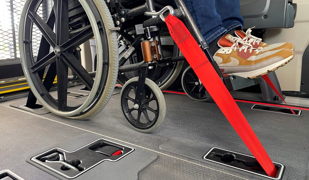 Tribus wheelchair fastening system